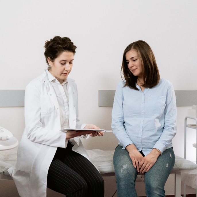 A woman doctor consulting with a woman patient